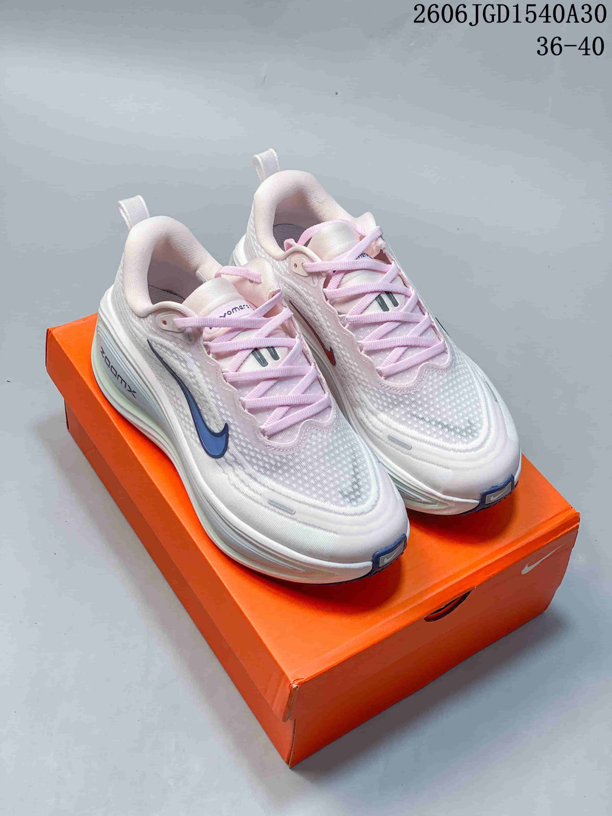 Nike Vomero Plus Running Shoes in White and Pink