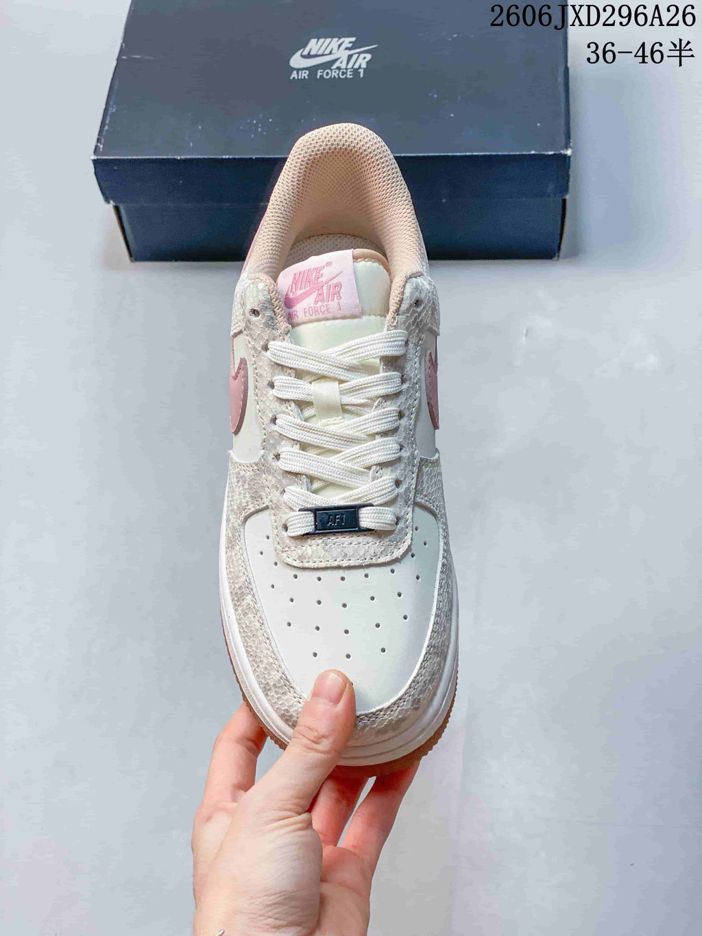 Nike Air Force 1 ’07 Low Sneakers in White and Pink