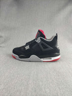 Jordan 4 Retro Sneaker in Black, Red and White