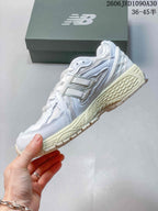 New Balance M1906R Sneakers in White and Silver