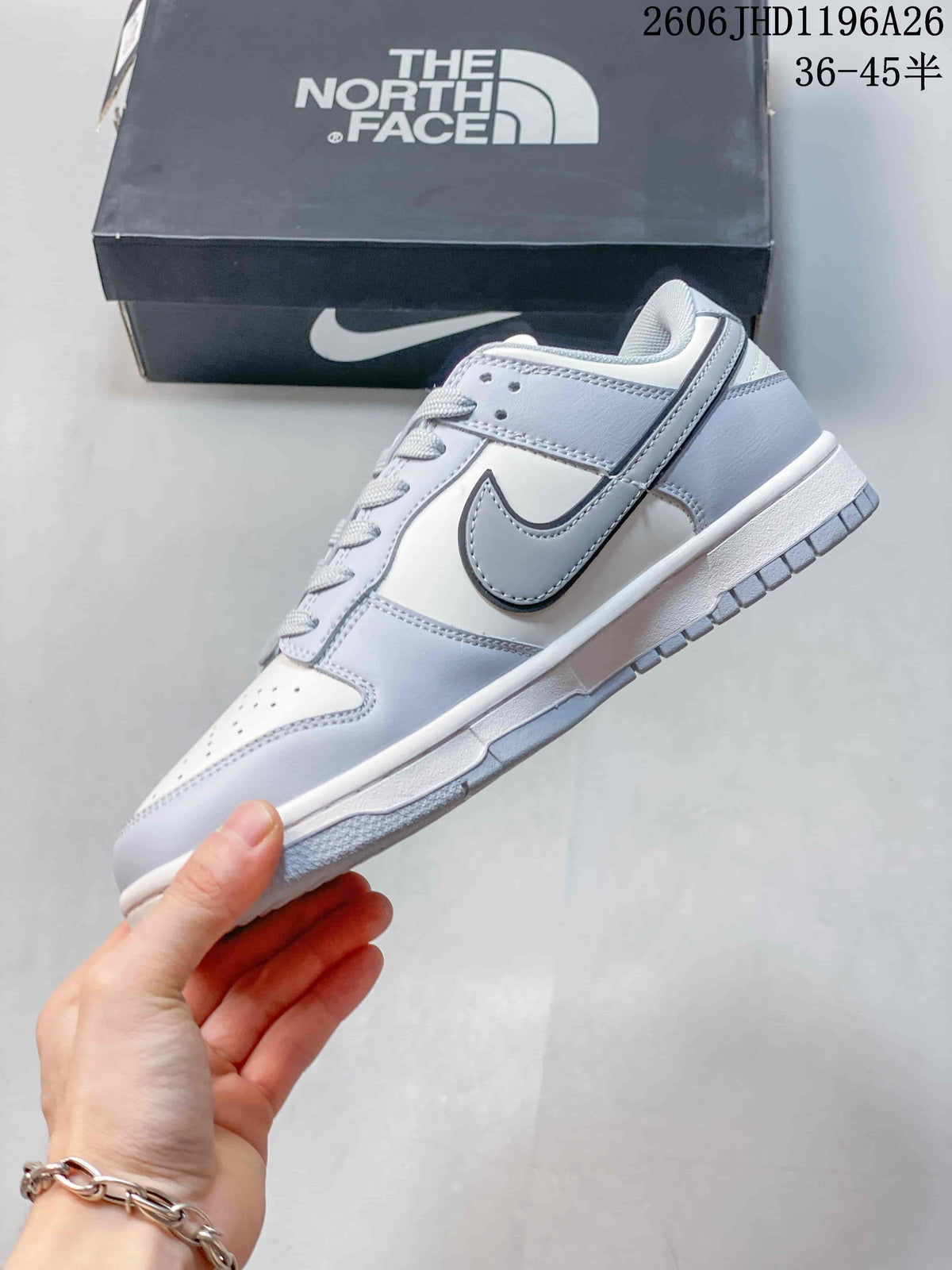 Nike SB Dunk Low Sneakers in White and Gray