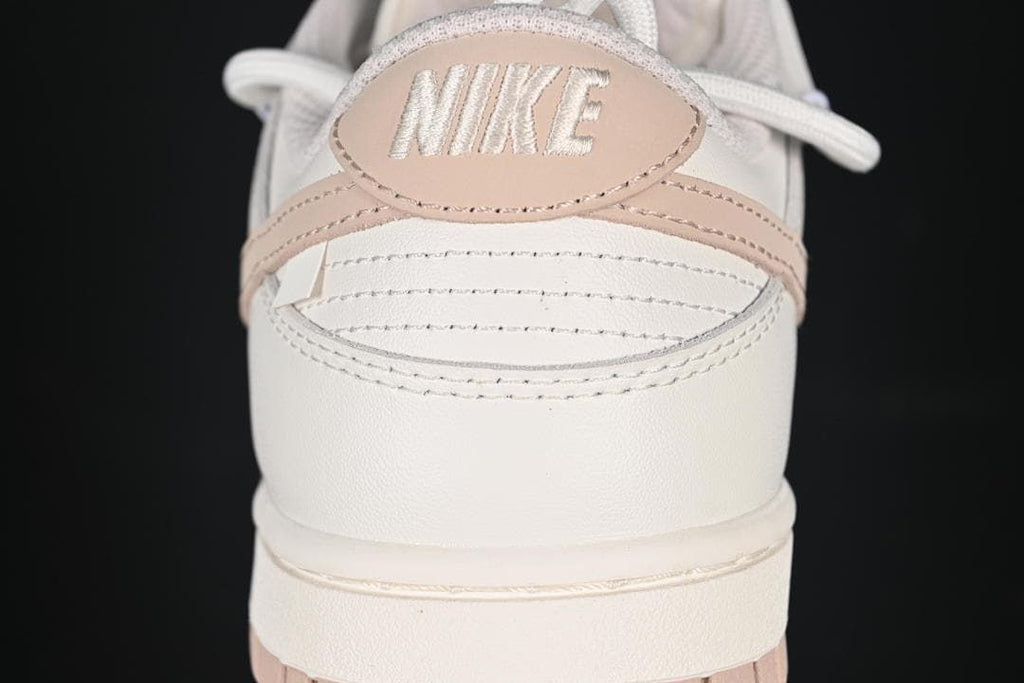 Nike SB Dunk Low Sneakers in White and Soft Pink
