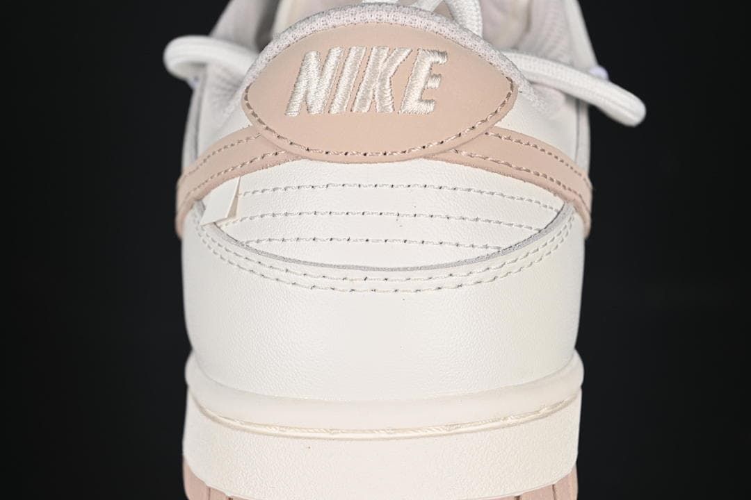 Nike SB Dunk Low Sneakers in White and Soft Pink