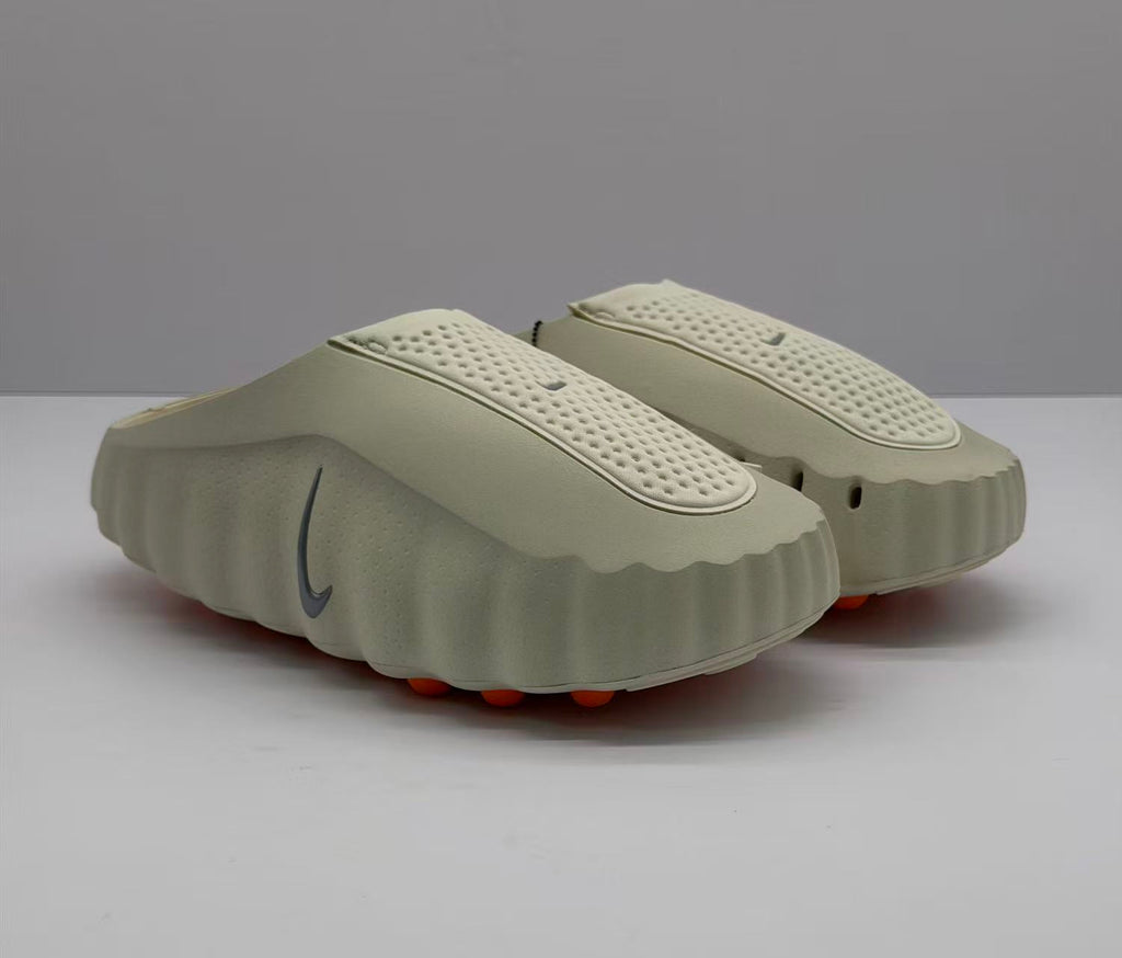 Nike Beige Slip-On Sandals with Orange Sole Details