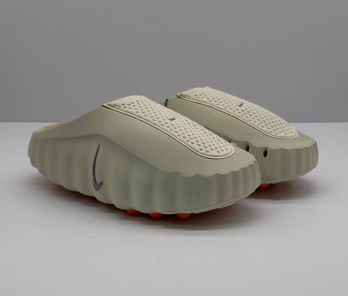Nike Beige Slip-On Sandals with Orange Sole Details