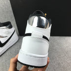 Air Jordan 1 Mid White and Black Sneakers