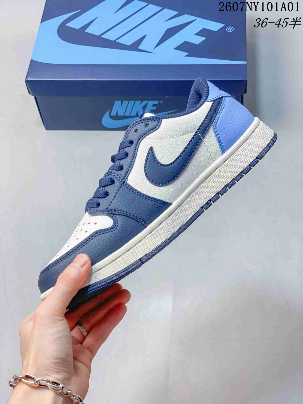 Nike Air Jordan 1 Low Sneakers in White and Blue