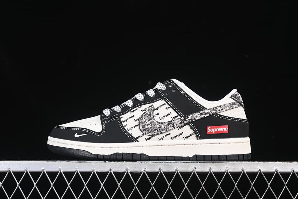 Nike SB Dunk Low Black and White Patterned Swoosh Sneakers