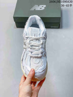 New Balance M1906R Sneakers in White and Silver