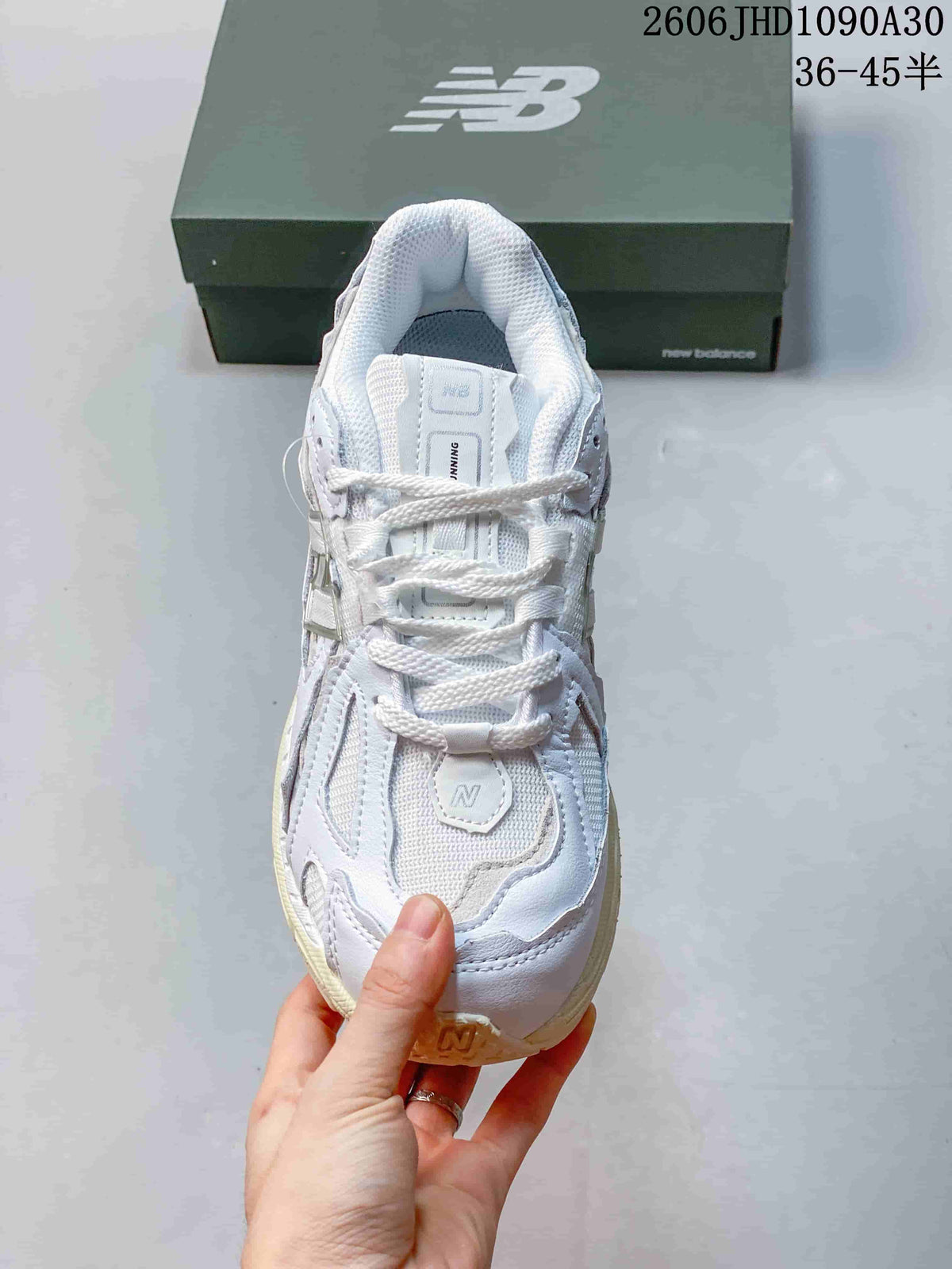 New Balance M1906R Sneakers in White and Silver