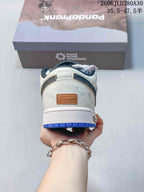 Jordan AJ1 Low Panda Prank Sneakers in White and Blue