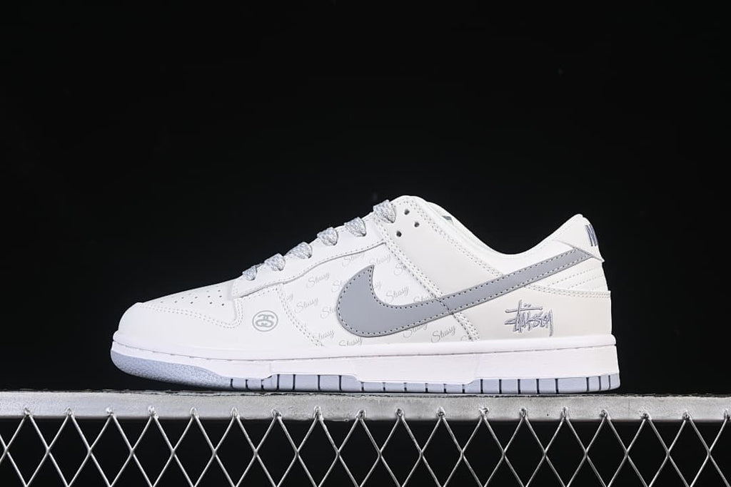 Nike SB Dunk Low White and Grey Stüssy Print Sneakers