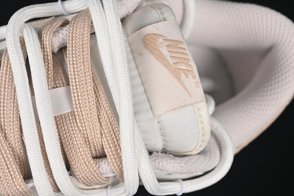 Nike SB Dunk Low Sneakers in White and Soft Pink