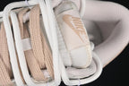 Nike SB Dunk Low Sneakers in White and Soft Pink