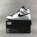 Air Jordan 1 Mid White and Black Sneakers