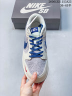 Nike SB Dunk Low Bearbrick-Inspired Cream and Blue Sneakers