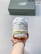 New Balance M1906R Sneakers in White and Silver