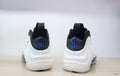 Nike Air Foamposite One High-Top Sneakers in Black, White and Blue
