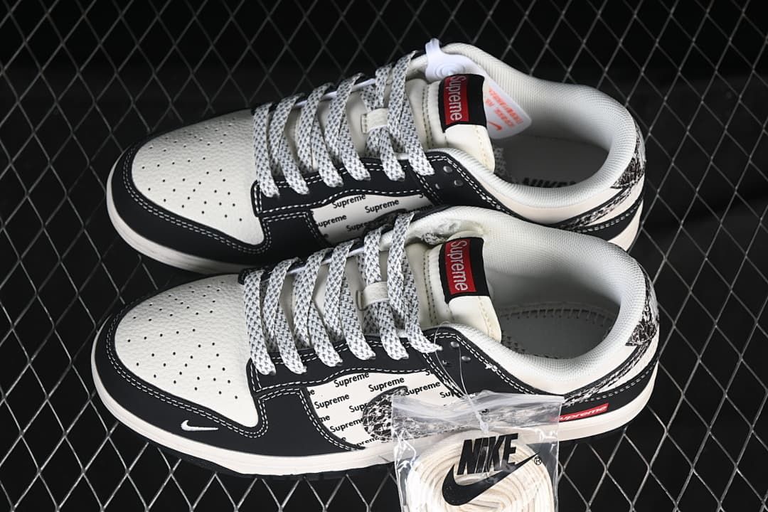 Nike SB Dunk Low Black and White Patterned Swoosh Sneakers