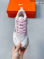 Nike Vomero Plus Running Shoes in White and Pink