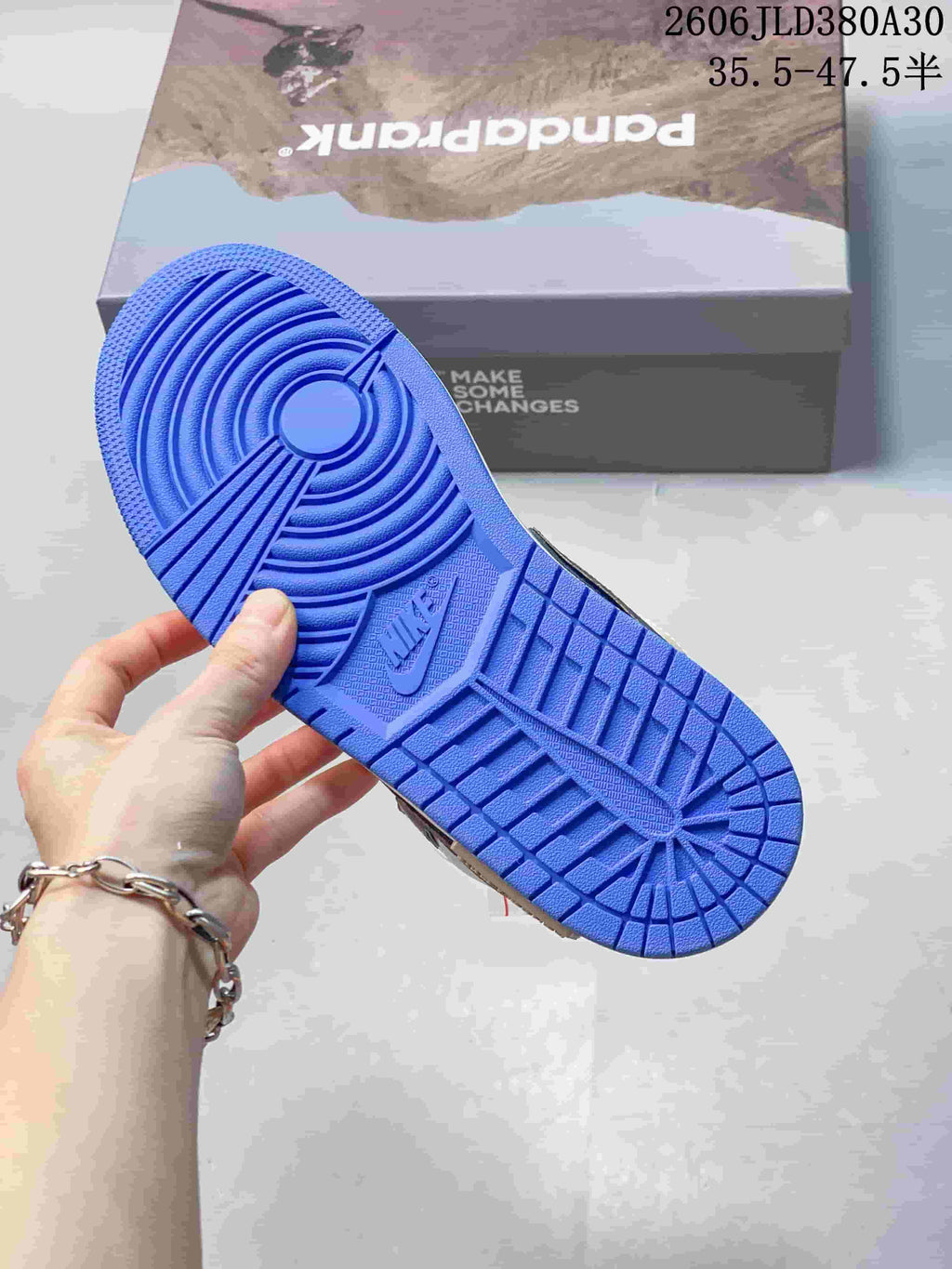 Jordan AJ1 Low Panda Prank Sneakers in White and Blue