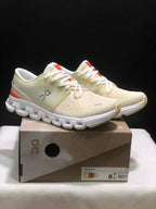 On Cloud X 4 Sneakers in Cream and Orange