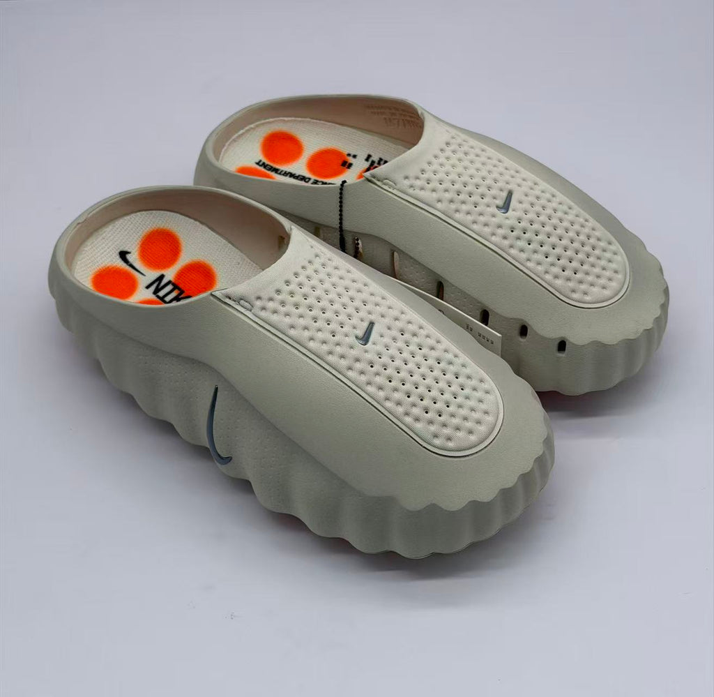 Nike Beige Slip-On Sandals with Orange Sole Details