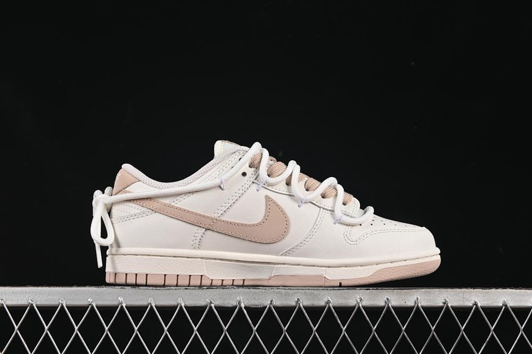 Nike SB Dunk Low Sneakers in White and Soft Pink