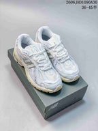 New Balance M1906R Sneakers in White and Silver