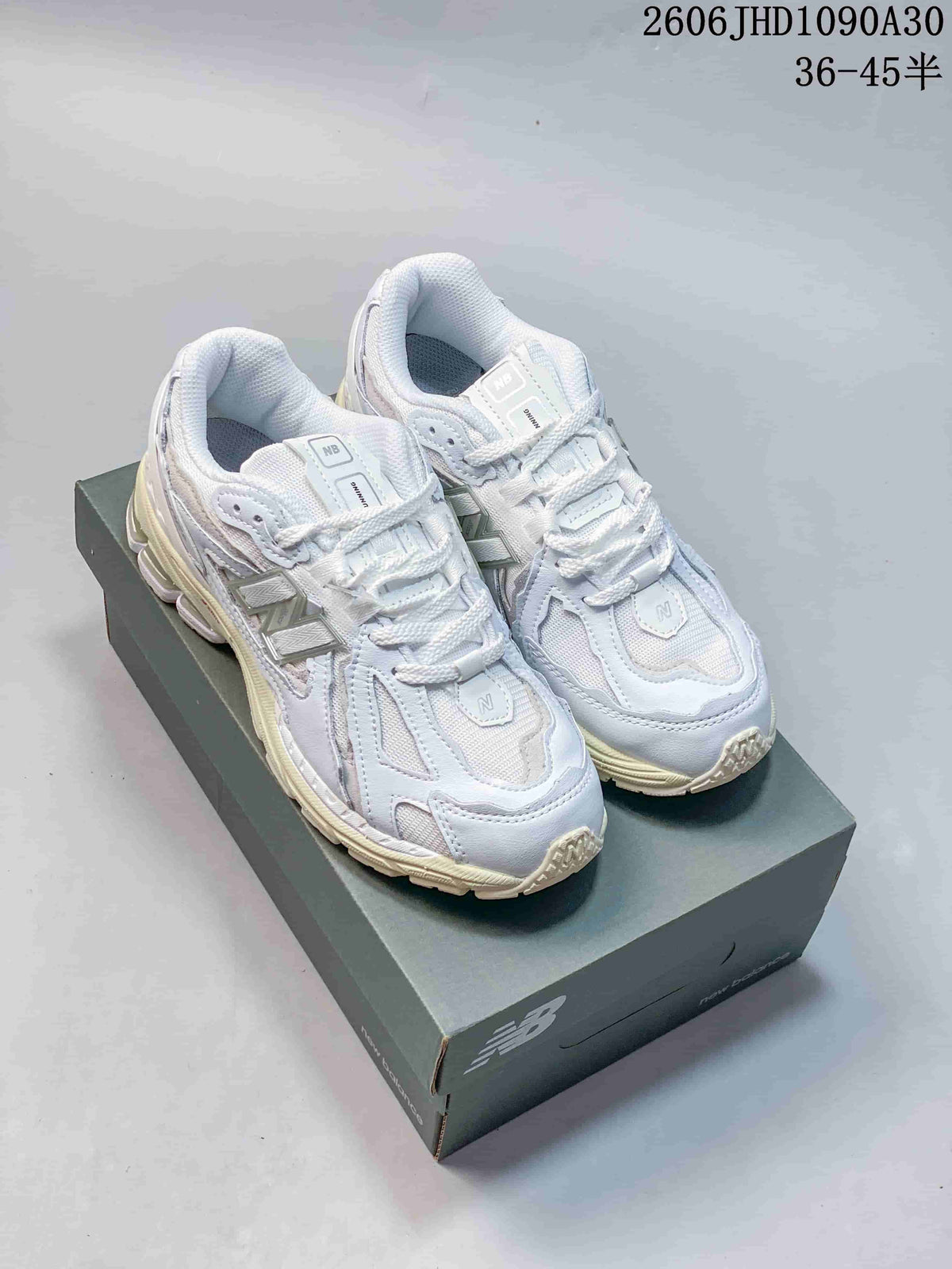 New Balance M1906R Sneakers in White and Silver