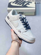 Nike Dunk Low White Sneakers with Navy Laces