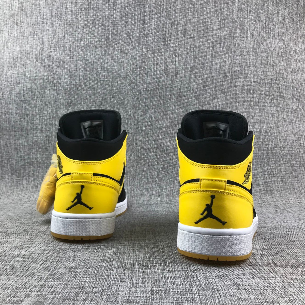 Air Jordan 1 Mid Black and Yellow Sneakers