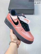Nike Air Force 1 ’07 Low Sneakers in Coral and Black