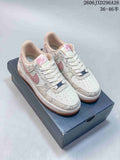 Nike Air Force 1 ’07 Low Sneakers in White and Pink
