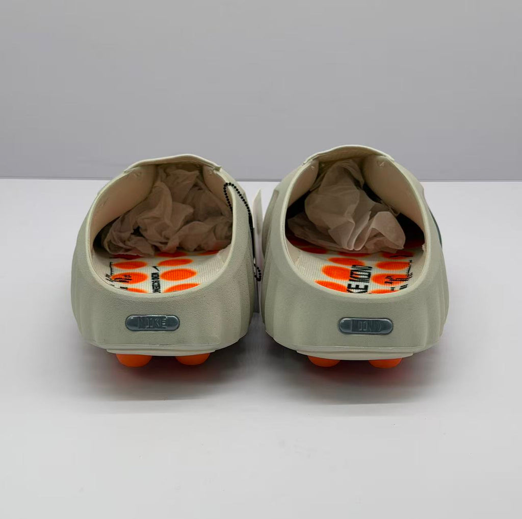 Nike Beige Slip-On Sandals with Orange Sole Details