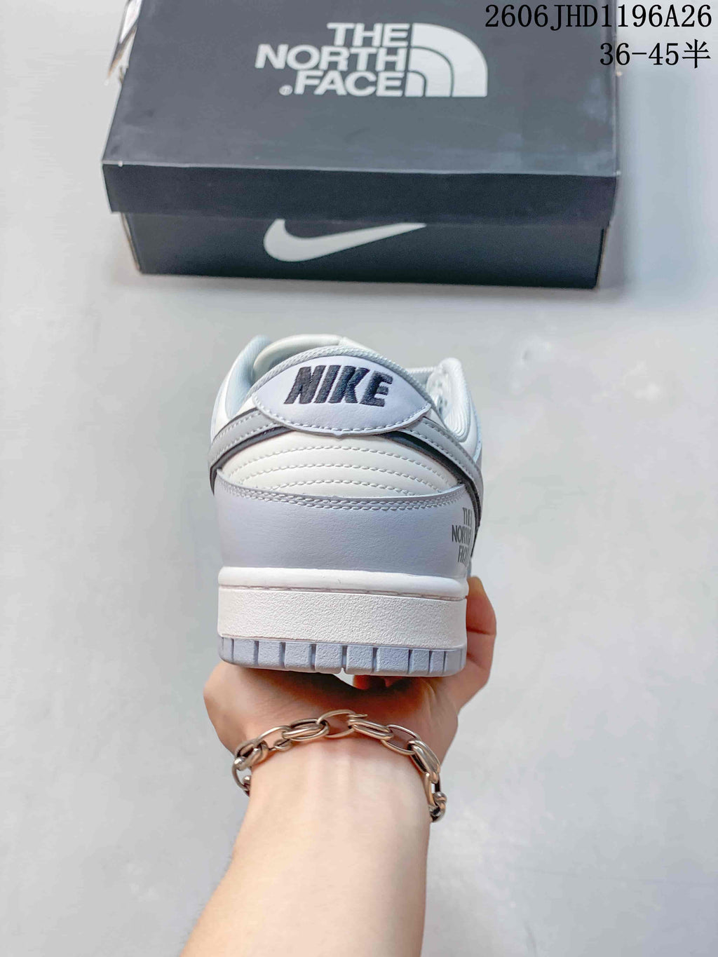Nike SB Dunk Low Sneakers in White and Gray
