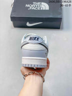 Nike SB Dunk Low Sneakers in White and Gray