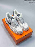 Low-Top Sneakers in White and Black with Monogram Details