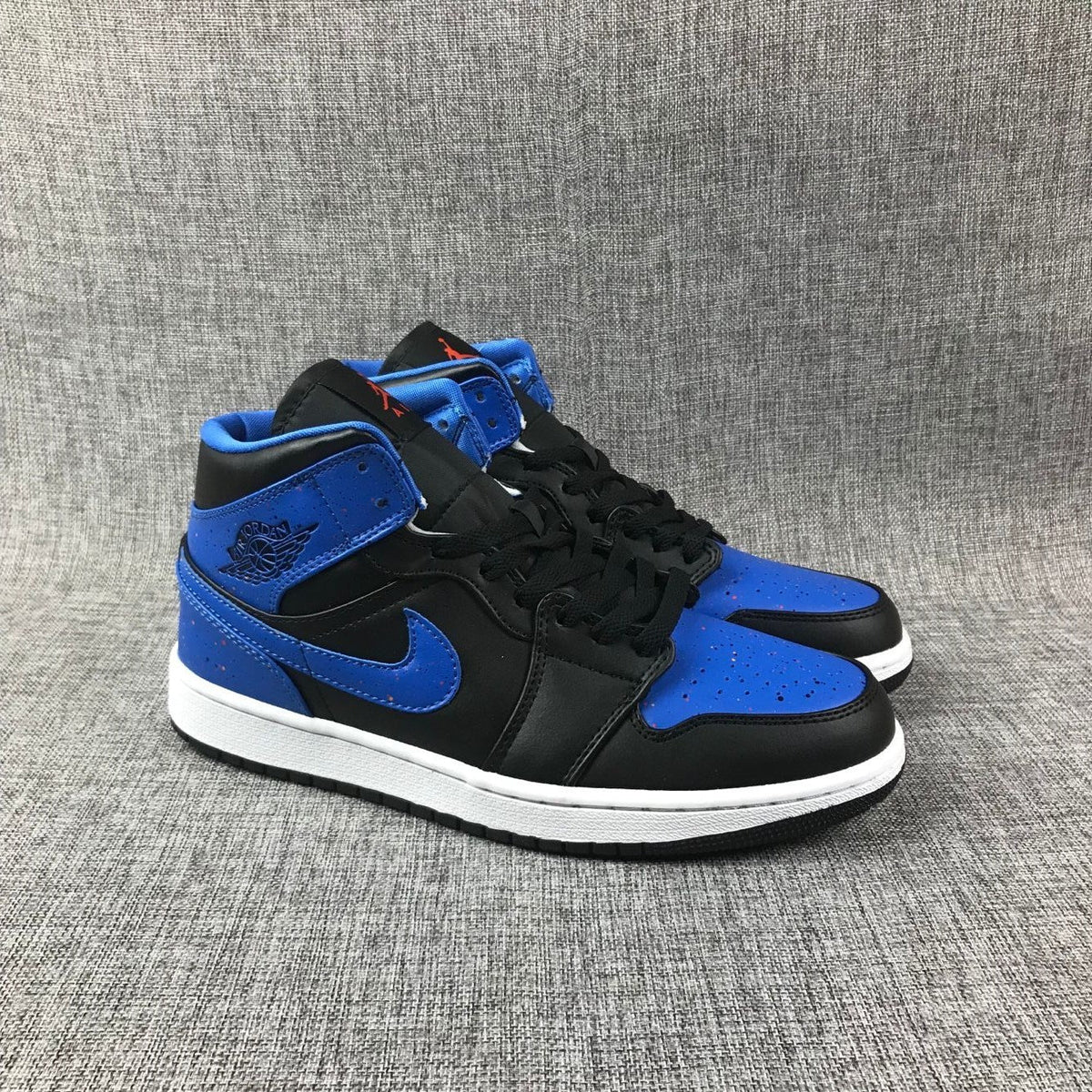Air Jordan 1 Mid Black and Blue High-Top Sneakers