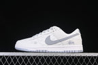 Nike SB Dunk Low White and Grey Stüssy Print Sneakers