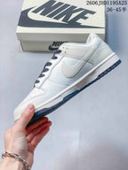 Nike Dunk Low White Sneakers with Navy Laces