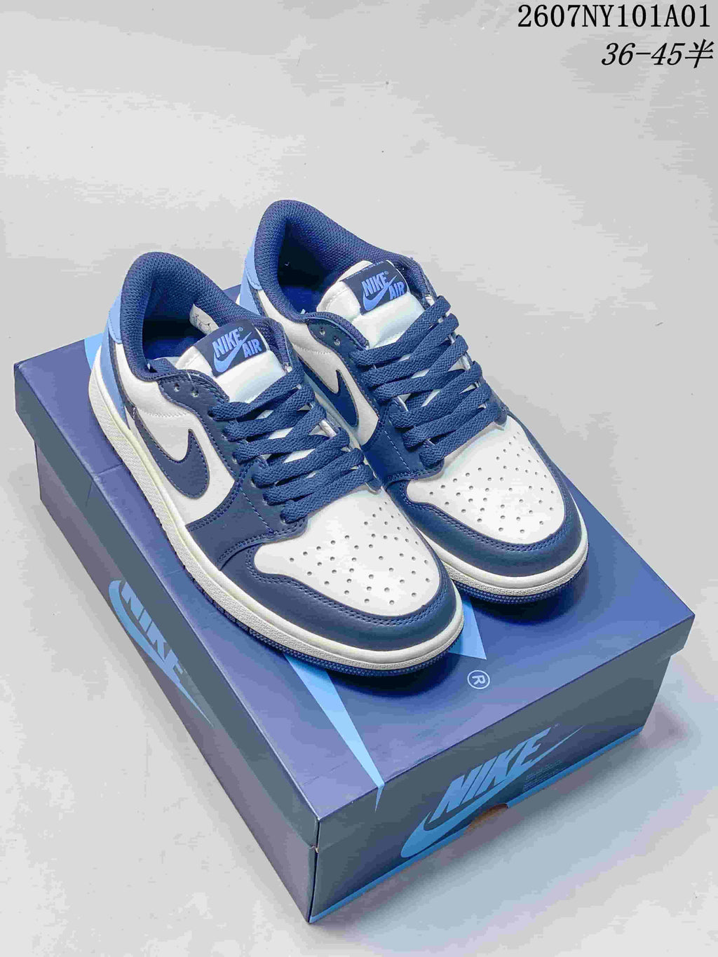 Nike Air Jordan 1 Low Sneakers in White and Blue