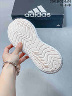 adidas AlphaBounce Beyond Running Sneakers in White and Pink