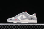 Nike SB Dunk Low Stüssy Snake Year Gray and Off-White Sneakers