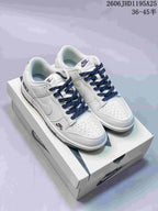 Nike Dunk Low Sneakers in White and Navy with Monogram Print