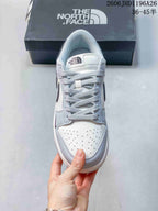 Nike SB Dunk Low Sneakers in White and Gray