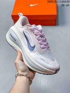 Nike Vomero Plus Running Shoes in White and Pink