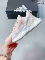 adidas AlphaBounce Beyond Running Sneakers in White and Pink