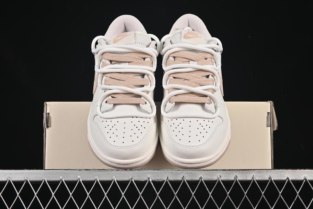 Nike SB Dunk Low Sneakers in White and Soft Pink