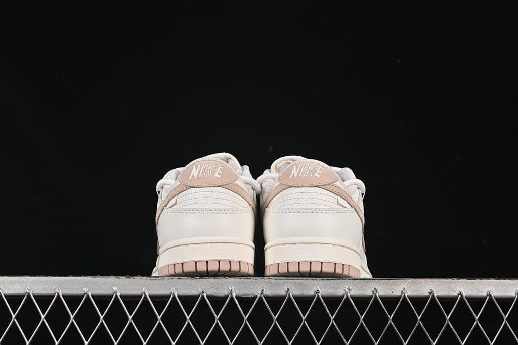 Nike SB Dunk Low Sneakers in White and Soft Pink